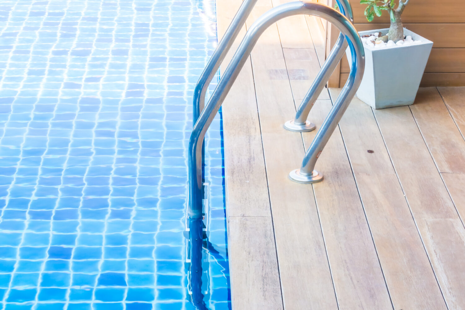 Swimming pool with stair in hotel pool resort