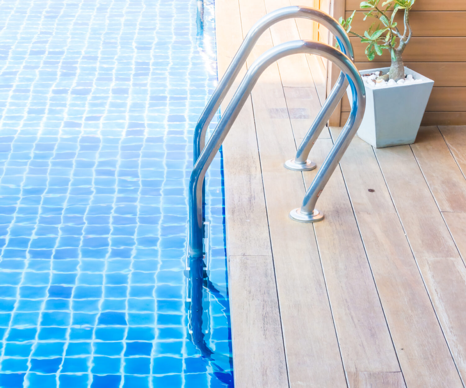 Swimming pool with stair in hotel pool resort